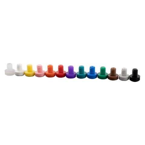 Row of thirteen color-coded Fusion Pro metering tips, from clear and white through yellow, pink, orange, red, purple, teal, blue, green, brown, gray, and black